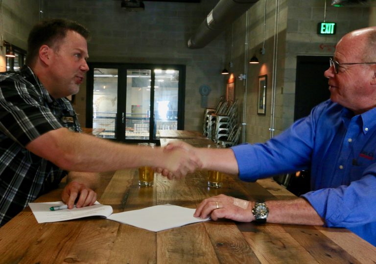 Doug Cone and Kent Bailey Handshake TEAM CONE