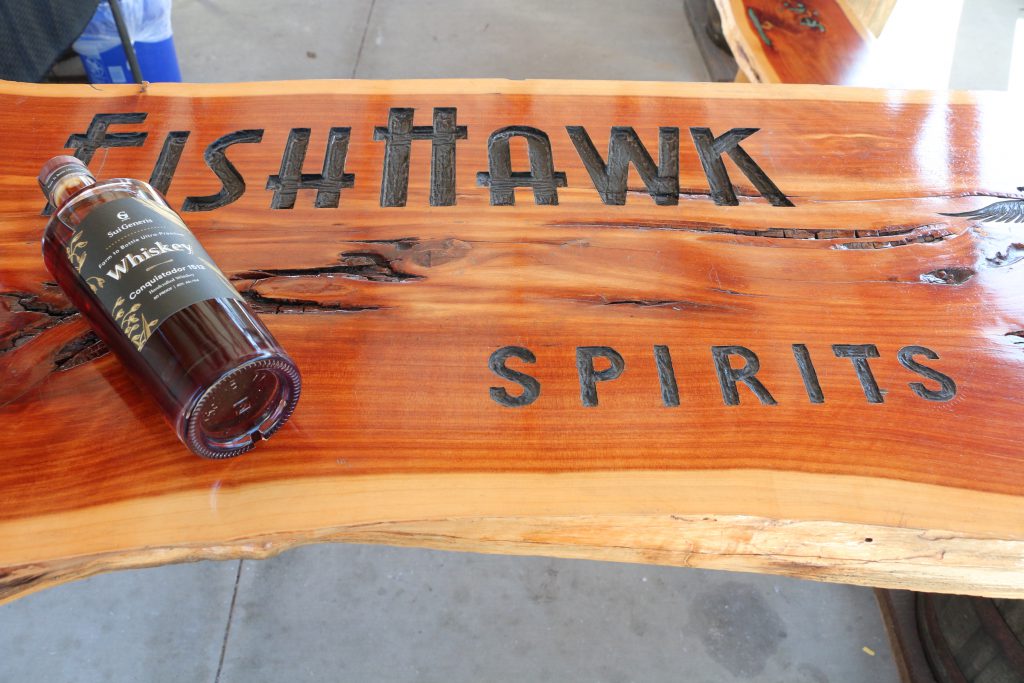 Fish Hawk Spirits Wood Sign with Whiskey