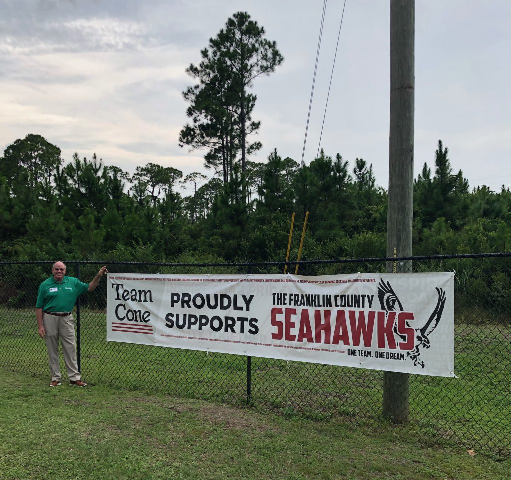 Team Cone founder Doug Cone in front of Franklin County school