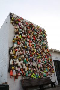 The wall of buoys in Apalachicola has provided Oyster City Brewing with colors for its beer cans.